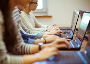 Students on computers learning possibly using AI