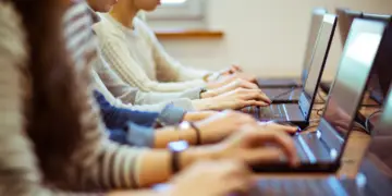 Students on computers learning possibly using AI