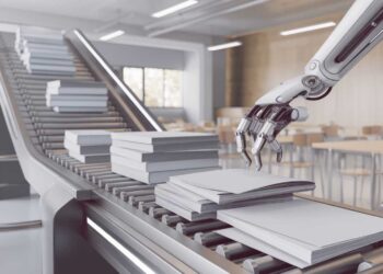 A robotic arm places books on a conveyor belt in a modern, well-lit room.